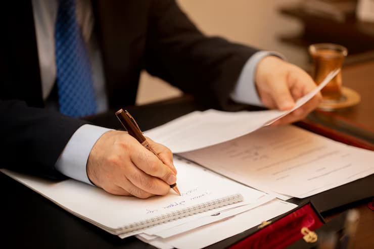 Man signing document